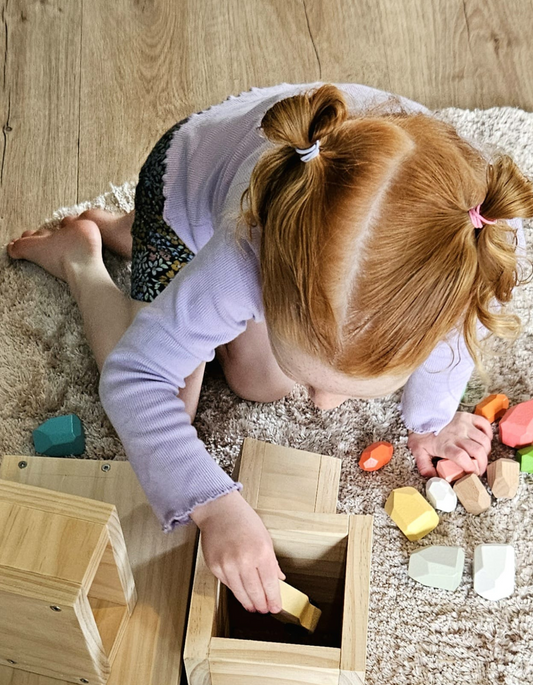 Posting Play: Why Children Love Putting Things Into Holes & Slots